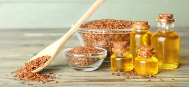 Ahşap masada keten yağlı kompozisyon