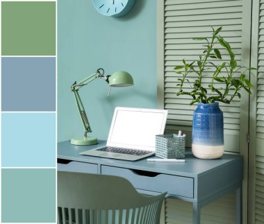Modern dizüstü bilgisayarı ve nane duvarının yanında lambası olan rahat bir iş yeri. Farklı renk desenleri