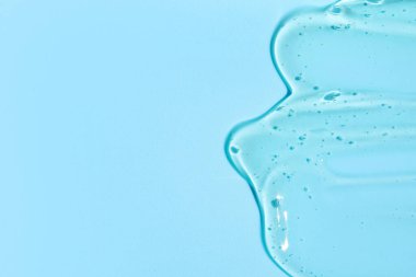 Mavi arka planda salyangoz sümüğü dokusu