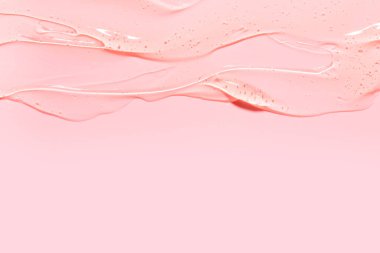 Pembe arka planda salyangoz sümüğü jeli dokusu