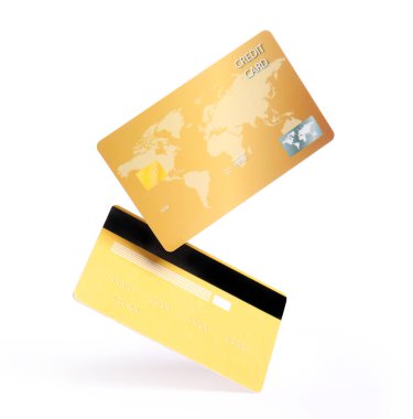 Beyaz arka planda uçan altın kredi kartları