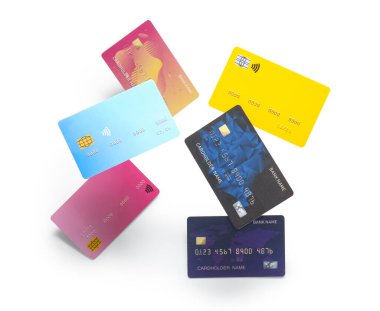 Beyaz arkaplanda renkli kredi kartları uçuyor