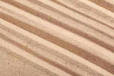 Arkaplan olarak çizgileri olan kum dokusu, yakın plan