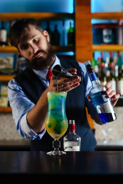 Bartender serve cocktail drink for customer at the bar