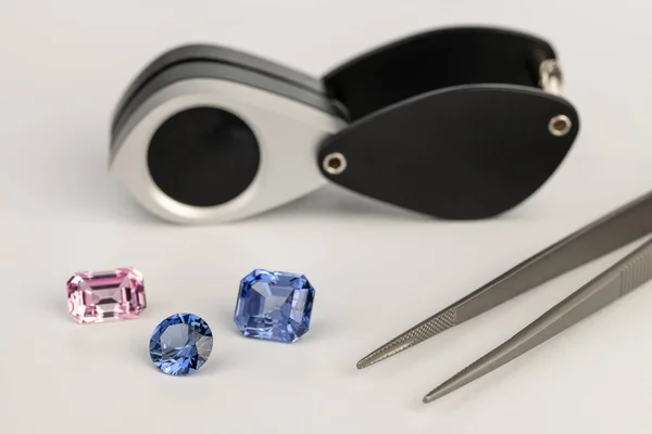 stock image Colorful Sapphire Gemstones With Tweezers and Loupe