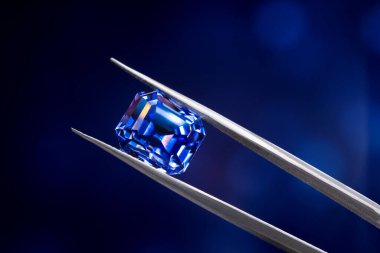 Precious Blue Sapphire Gemstone on Dark Background clipart