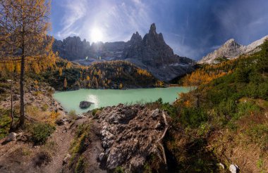 The specular landscape turquoise water of Lake Sorapis in autumn season, Dolomite, Italy. clipart