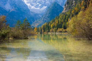 Stunning landscape and reflection of Landro lake in autumn, Dolomite Italy. clipart