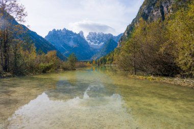 Stunning landscape and reflection of Landro lake in autumn, Dolomite Italy. clipart