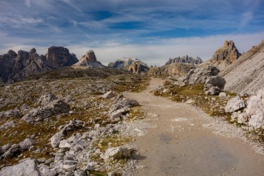 The specular landscape of trial routh to Tre Cime, Dolomite, Italy. clipart