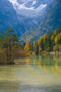 Stunning landscape and Becco di Mezzod peak reflection of Federa lake in autumn Dolomite Italy clipart