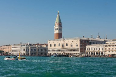 Doges palace, Library and St. Marco tower from water, Venice, Italy.
