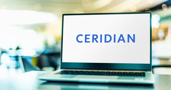 Stock image POZNAN, POL - MAY 4, 2022: Laptop computer displaying logo of Ceridian HCM, an American provider of human resources software and services