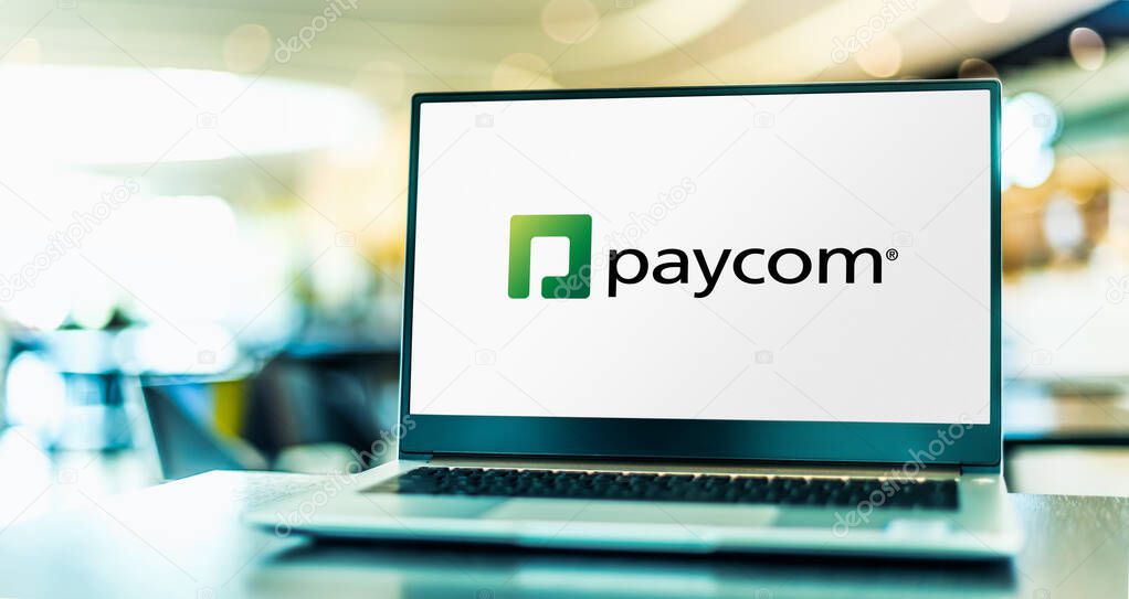 POZNAN, POL - MAY 4, 2022: Laptop computer displaying logo of Paycom Software, Inc., an American online payroll and human resource technology provider based in Oklahoma City