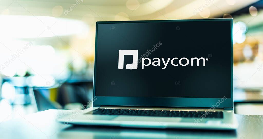 POZNAN, POL - MAY 4, 2022: Laptop computer displaying logo of Paycom Software, Inc., an American online payroll and human resource technology provider based in Oklahoma City