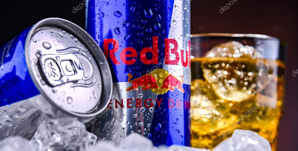 POZNAN, POL - NOV 25, 2022: Cans of Red Bull, an energy drink sold by Red Bull GmbH, an Austrian company created in 1987