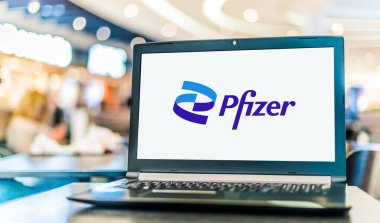 POZNAN, POL - OCT 28, 2022: Laptop computer displaying logo of Pfizer, a multinational pharmaceutical and biotechnology corporation headquartered in New York City, USA