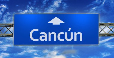 Road sign indicating direction to the city of Cancun.