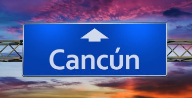 Road sign indicating direction to the city of Cancun.