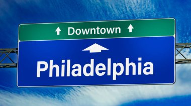 Road sign indicating direction to the city of Philadelphia.