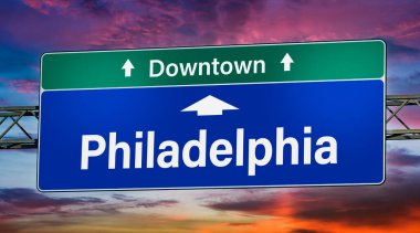 Road sign indicating direction to the city of Philadelphia.