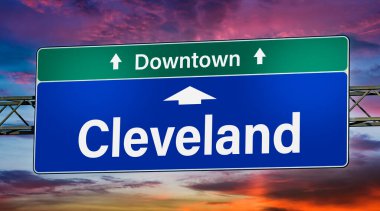 Road sign indicating direction to the city of Cleveland.
