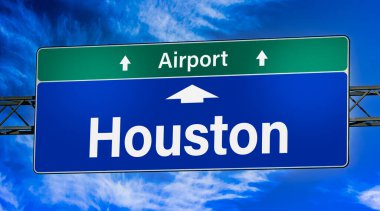 Road sign indicating direction to the city of Houston.