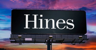 POZNAN, POL - FEB 8, 2023: Advertisement billboard displaying logo of Hines Interests Limited Partnership, a privately held company that invests in and develops real estate