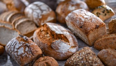 Assorted bakery products including loaves of bread and rolls