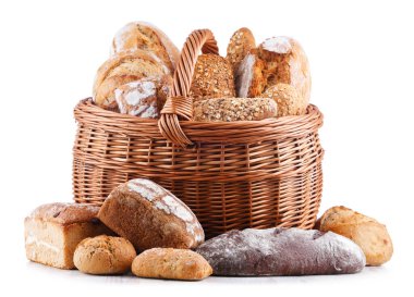 Wicker basket with bakery products including loaves of bread and rolls