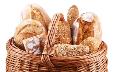 Wicker basket with bakery products including loaves of bread and rolls