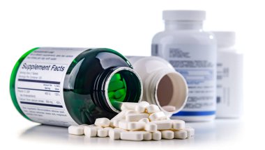 Composition with dietary supplement containers isolated on white