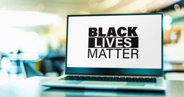 Laptop computer displaying the sign of Black Lives Matter movement. clipart