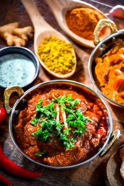 Hot madras paneer and vegetable masala with basmati rice served in original indian karahi pots.