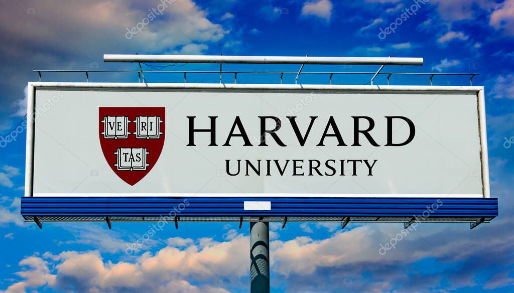 POZNAN, POL - MAR 7, 2023: Advertisement billboard displaying logo of Harvard University, a private Ivy League research university in Cambridge, Massachusetts