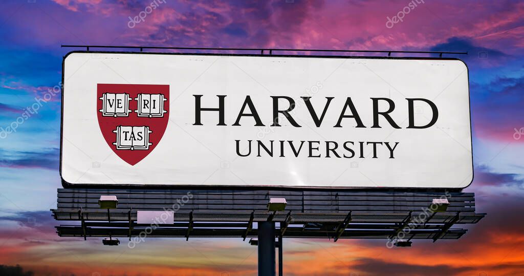 POZNAN, POL - MAR 7, 2023: Advertisement billboard displaying logo of Harvard University, a private Ivy League research university in Cambridge, Massachusetts