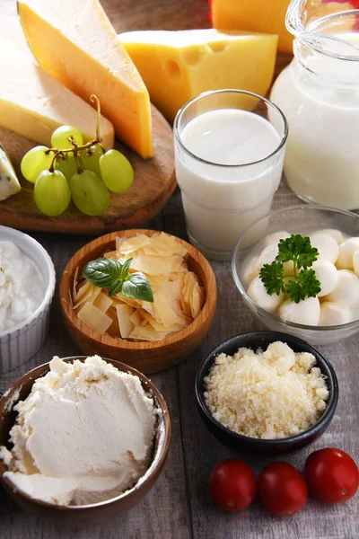 stock image A variety of dairy products including cheese, milk and yogurt.