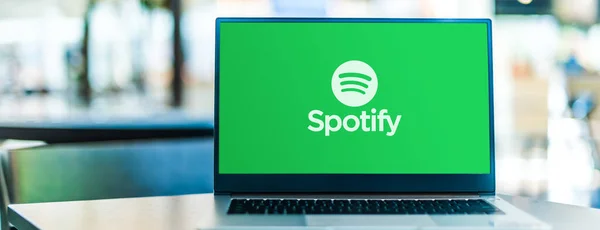 stock image POZNAN, POL - SEP 23, 2020: Laptop computer displaying logo of Spotify, a Swedish audio streaming platform that provides music and podcasts from record labels and media companies