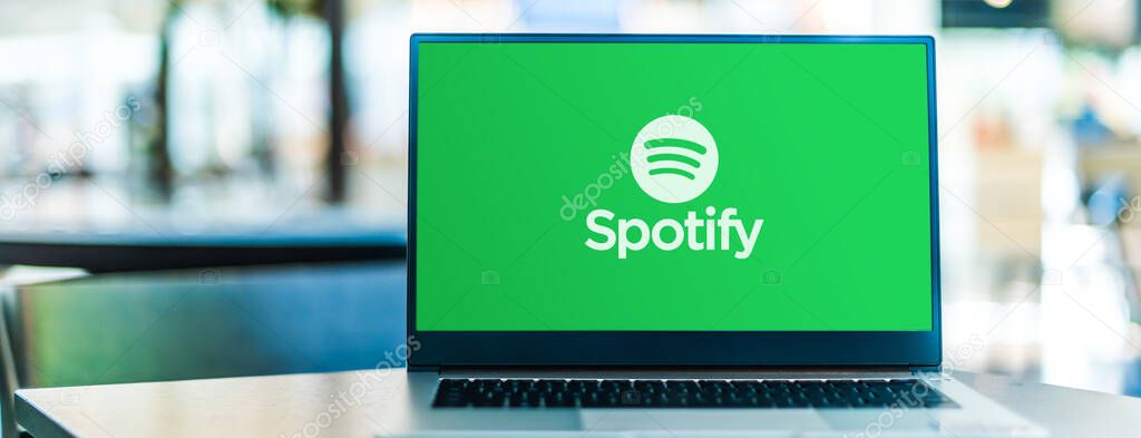 POZNAN, POL - SEP 23, 2020: Laptop computer displaying logo of Spotify, a Swedish audio streaming platform that provides music and podcasts from record labels and media companies