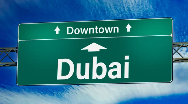 stock image Road sign indicating direction to the city of Dubai.