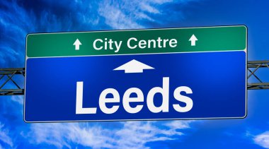 Road sign indicating direction to the city of Leeds. clipart
