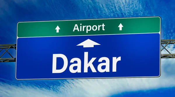 stock image Road sign indicating direction to the city of Dakar.