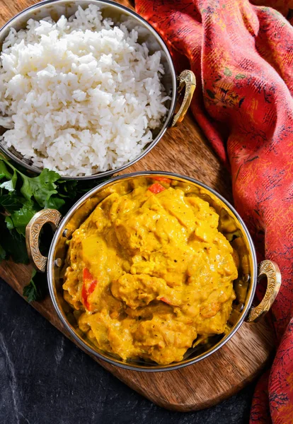 stock image Curry chicken with rice served in original indian karahi pots.