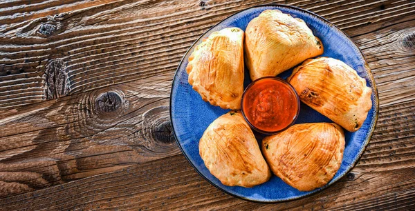 stock image Composition with a plate of oven-baked pierogi