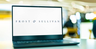 POZNAN, POL - FEB 8, 2023: Laptop computer displaying logo of Frost and Sullivan, an American business consulting firm