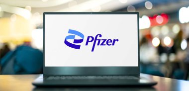 POZNAN, POL - OCT 28, 2022: Laptop computer displaying logo of Pfizer, a multinational pharmaceutical and biotechnology corporation headquartered in New York City, USA