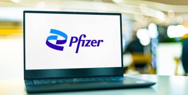 POZNAN, POL - OCT 28, 2022: Laptop computer displaying logo of Pfizer, a multinational pharmaceutical and biotechnology corporation headquartered in New York City, USA