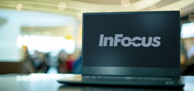 POZNAN, POL - APR 7, 2022: Laptop computer displaying logo of InFocus Corporation, an American privately owned company based in Oregon