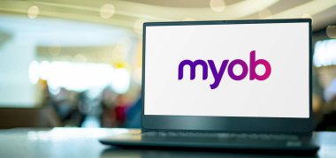 POZNAN, POL - APR 7, 2022: Laptop computer displaying logo of MYOB, an Australian corporation that provides tax, accounting and other business services software to small and medium businesses