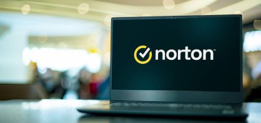 POZNAN, POL - APR 7, 2022: Laptop computer displaying logo of Norton AntiVirus, an anti-virus or anti-malware software product, developed and distributed by Symantec Corporation